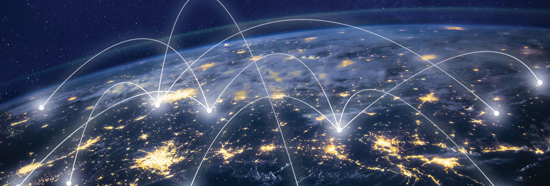 Satellite view of the globe with connected locations representing remote monitoring of UPS devices across multiple sites.